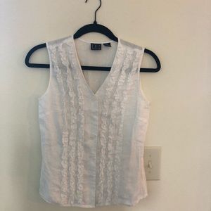 . White sleeveless linen blouse.